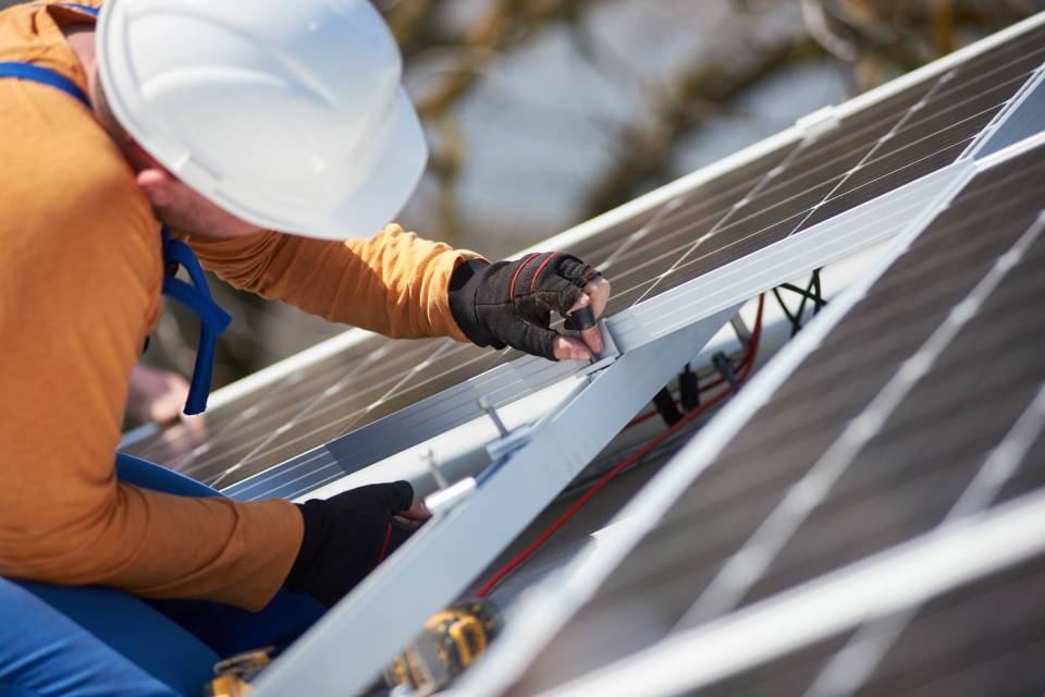 installing-solar-photovoltaic-panel-system-on-roof-2022-05-16-16-02-24-utc